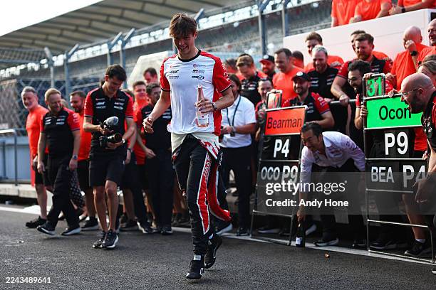 Fourth placed Oliver Bearman of Great Britain and Haas F1 and the Haas F1 team celebrate during the F1 Grand Prix of Mexico at Autodromo Hermanos...