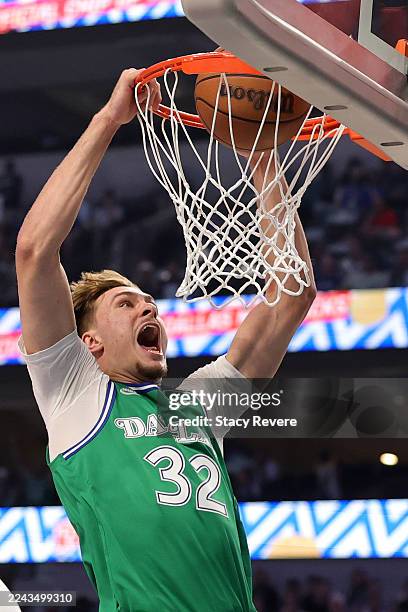 Cooper Flagg of the Dallas Mavericks dunks against the Toronto Raptors during the first half at American Airlines Center on October 26, 2025 in...