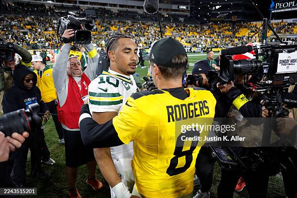 Jordan Love of the Green Bay Packers greets Aaron Rodgers of the Pittsburgh Steelers following the game at Acrisure Stadium on October 26, 2025 in...