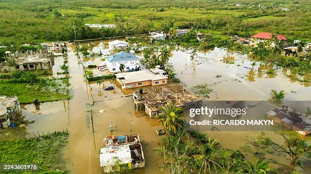An aerial view dated October 29, 2025 shows a flooded Wilton Community following the passage the previous day of Hurricane Melissa, in St. Elizabeth,...