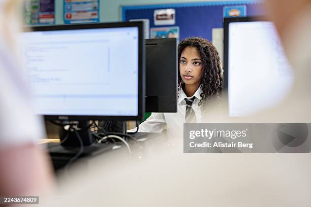 female high school student working on a computer in a school it class - girl coding stock pictures, royalty-free photos & images