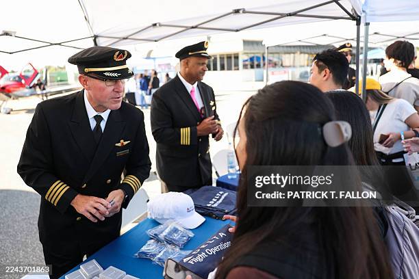 Delta Air Lines pilots speak with students about training and career paths during the 10th annual Aviation Career Day at Los Angeles International...