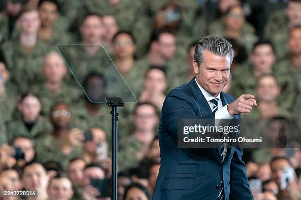 Secretary of War Pete Hegseth delivers a speech ahead of the arrival of President Donald Trump aboard USS George Washington on October 28, 2025 in...