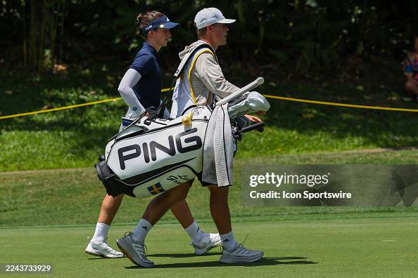 Pontus Samuelson Linn Grant of Sweden walk with her caddie, Pontus Samuelsson to the ...
