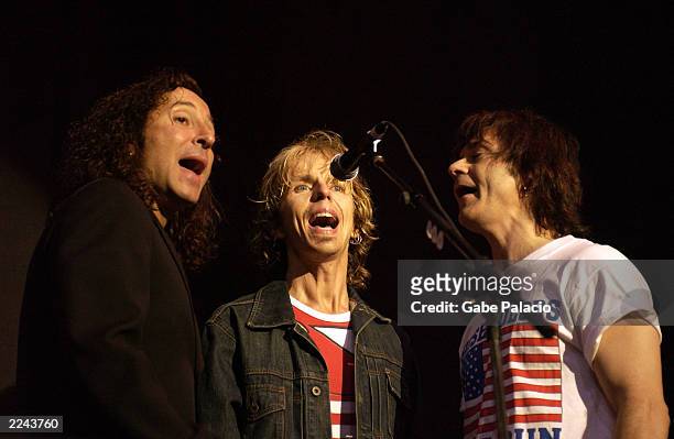 Steve Augeri of Journey, Tommy Shaw and Lawrence Gowen of Styx performing at the "Volunteers for America" rock benefit concert at the HiFi Buys...