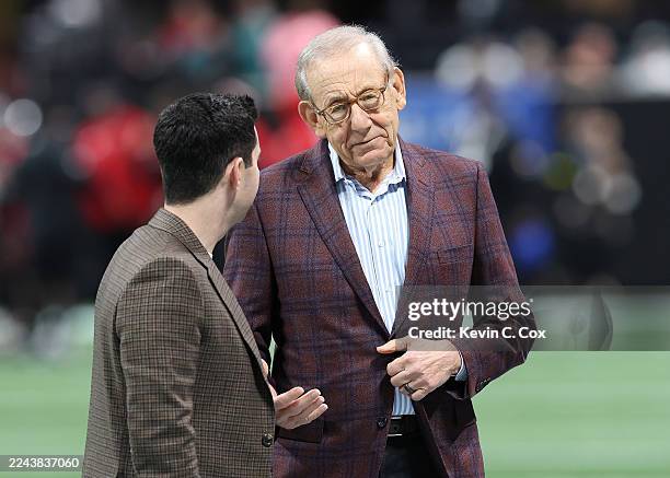 Miami Dolphins Chairman and Managing General Partner Stephen M. Ross converses with son-in-law Dan Sillman during warmups prior to the game between...