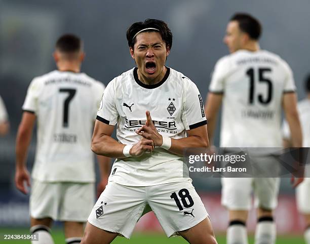 Shuto Machino of Borussia Monchengladbach celebrates scoring his team's first goal during the DFB Cup match between Borussia Mönchengladbach and...
