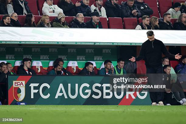Augsburg's German head coach Sandro Wagner reacts at the end of the German first division Bundesliga football match between FC Augsburg and Borussia...