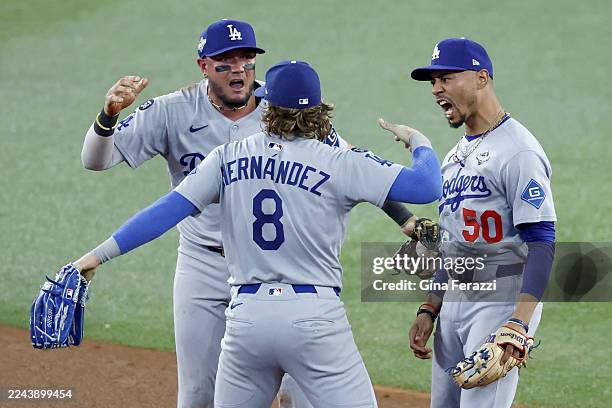 Toronto, Ontario, Canada October 31, 2025: Los Angeles Dogders Miguel Rojas, left, and Los Angeles Dodgers shortstop Mookie Betts , right,...