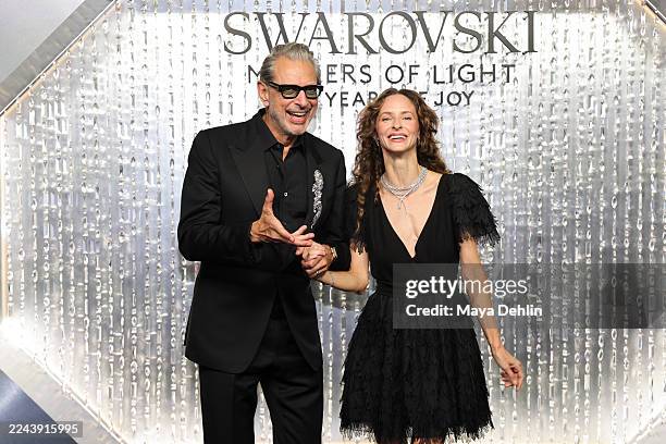 Jeff Goldblum and Emilie Goldblum arrive at the Swarovski Masters of Light Opening Celebration on October 28, 2025 in Los Angeles, California.