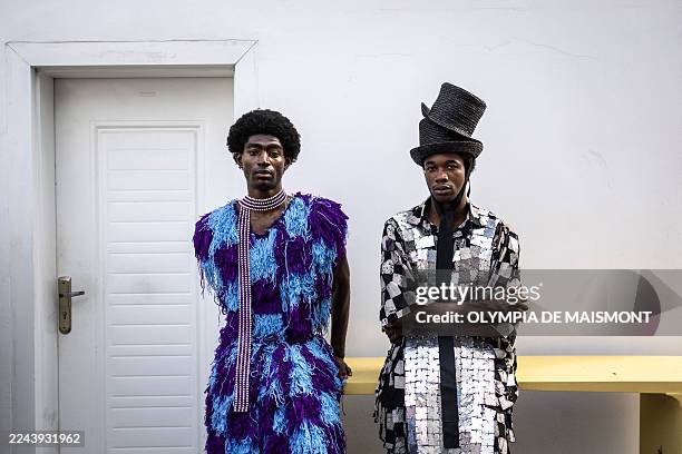 Models wearing creations by Nigerian designer Bubu Ogisi at Iamisigo brand pose for a photograph ahead of a private presentation and performance to...