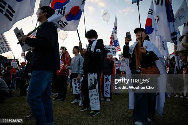 Right-leaning groups, led by Liberty University, held a rally to support Trump shouting "Chinese Communist Party Out" while U.S. President Donald...