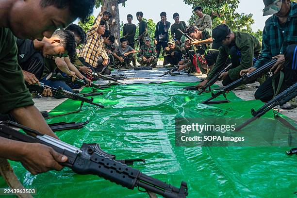 Fighters from Battalion 12 in Shwebo District conduct a weapons training. The People's Defense Force operates under the command of the National Unity...