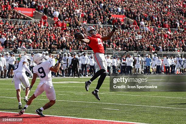 Ohio State Buckeyes wide receiver Jeremiah Smith catches a pass for a touchdown during the game against the Penn State Nittany Lions and the Ohio...