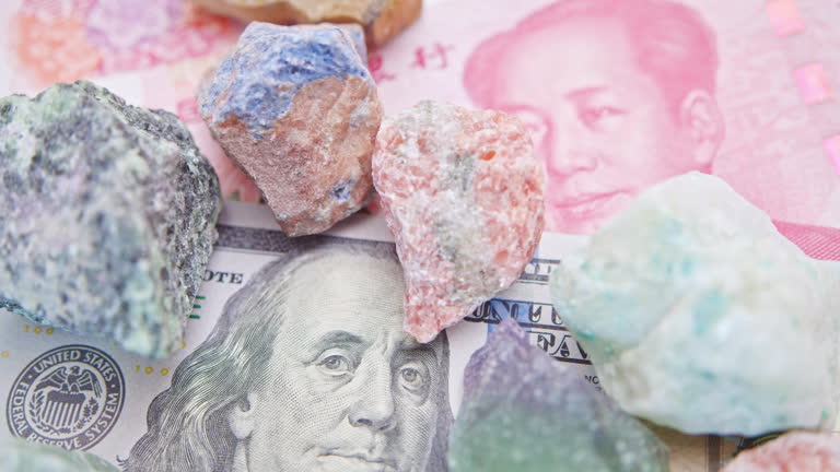 https://media.gettyimages.com/id/2244036765/video/mineral-ore-on-us-dollar-and-chinese-yuan-strategic-raw-materials-and-geopolitical-trade.jpg?b=1&s=640x640&k=20&c=uX4b2wgvA6vL3GCNEWf_AnSirgL8P7ellIFdDluLyXs=