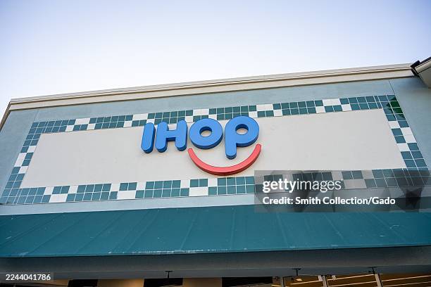 Low-angle view of sign on facade of IHOP Restaurant, Walnut Creek, California, October 29, 2025.