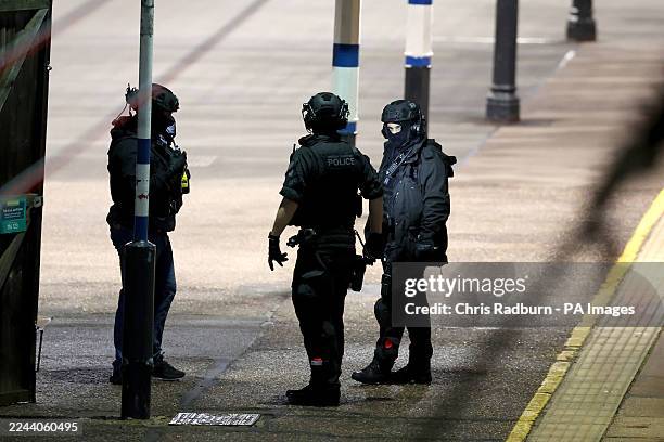 British Transport Police emergency responders on the platform by the train at Huntingdon station in Cambridgeshire, after a number of people were...