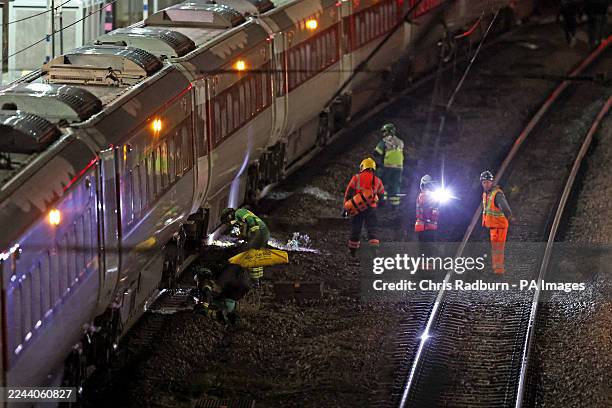 Emergency responder on the tracks by the train at Huntingdon station in Cambridgeshire, after a number of people were stabbed. Two people have been...