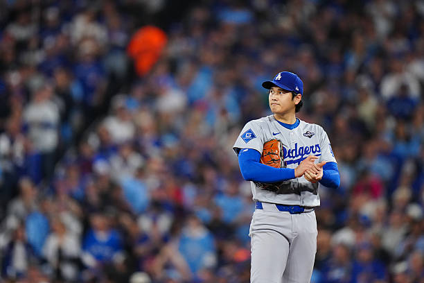 Shohei Ohtani of the Los Angeles Dodgers prepares to pitch during Game Seven of the 2025 World Series presented by Capital One between the Los...