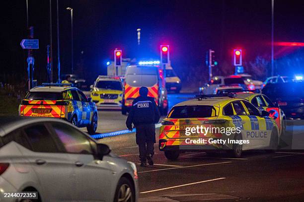 Police and other emergency responders attend to Huntingdon Station on November 2, 2025 in Huntingdon, England after a stabbing attack on a train....