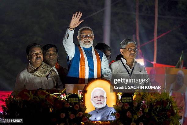 Narendra Modi , India's Prime Minister and leader of the Bharatiya Janata Party waves to supporters during his roadshow in Patna, ahead of assembly...