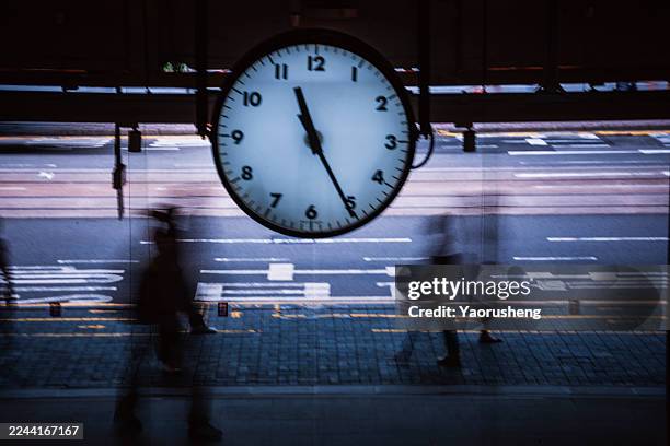 clock and commuters in central market, hong kong - time lapse clock stock pictures, royalty-free photos & images
