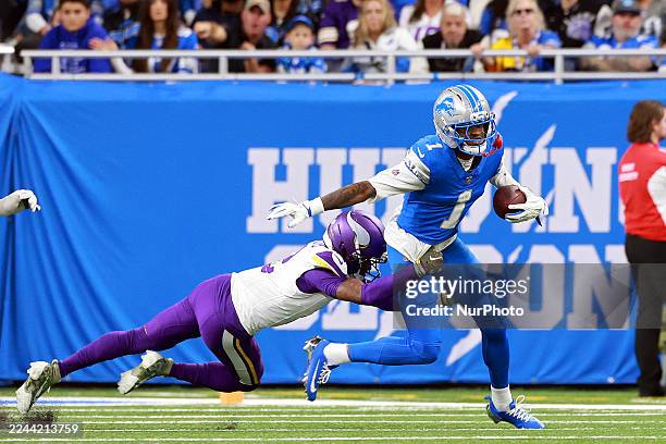 November2: Wide receiver Jameson Williams of the Detroit Lions is tackled by cornerback Isaiah Rodgers of the Minnesota Vikings during an NFL...