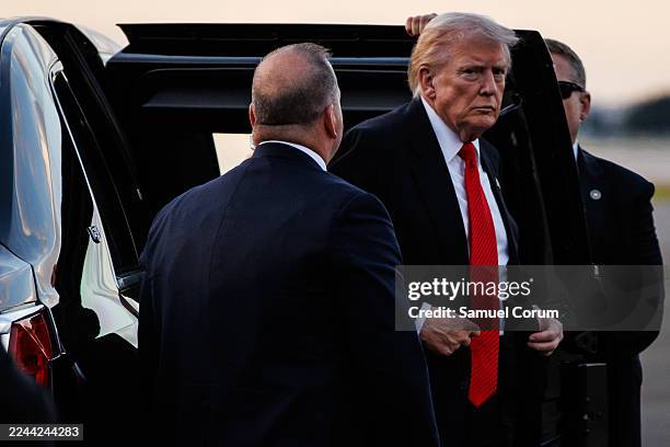 President Donald Trump steps out of the Presidential limousine before boarding Air Force One en route to the White House on November 2, 2025 at Palm...