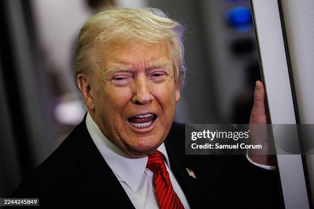 President Donald Trump speaks to reporters aboard Air Force One en route to the White House on November 2, 2025 after taking off from Palm Beach...