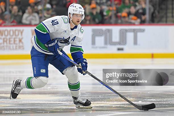 Vancouver Canucks forward Elias Pettersson skates with the puck during a NHL game between the Minnesota Wild and Vancouver Canucks on November 1 at...