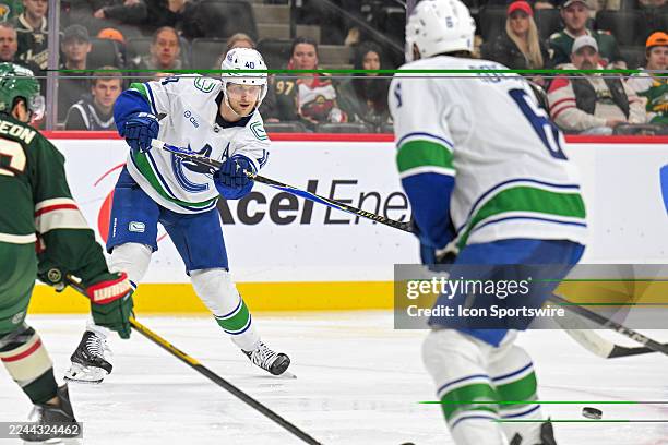Vancouver Canucks forward Elias Pettersson makes a pass during a NHL game between the Minnesota Wild and Vancouver Canucks on November 1 at Grand...