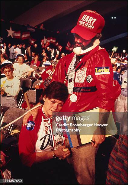 View of election delegates , one on the telephone, on the floor during the Democratic National Convention at the Moscone Center, San Francisco,...