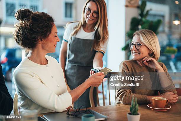 modern cashless payment at café - digital currency stock pictures, royalty-free photos & images