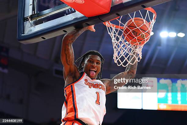Donnie Freeman of the Syracuse Orange reacts while dunking against the Binghamton Bearcats during the second half at the JMA Wireless Dome on...