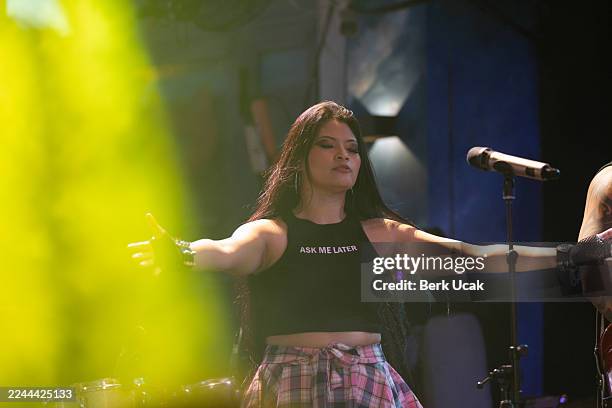 a singer woman performs on stage in nightlife. - boygroup stock-fotos und bilder