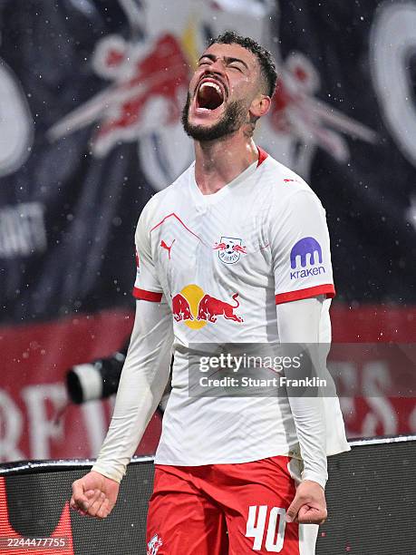 Romulo Cardoso of RB Leipzig celebrates scoring his team's third goal during the Bundesliga match between RB Leipzig and VfB Stuttgart at Red Bull...