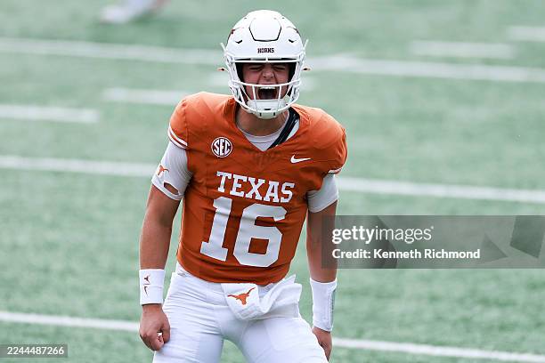 Arch Manning of the Texas Longhorns celebrates after throwing a touchdown pass to Ryan Wingo during the first quarter of the game against the...