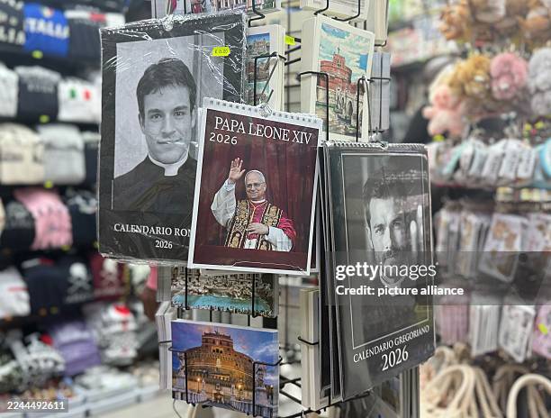 November 2025, Italy, Rom: Calendars of Pope Leo XIV and real and fake priests are sold around St. Peter's Basilica. Photo: Christoph Sator/dpa