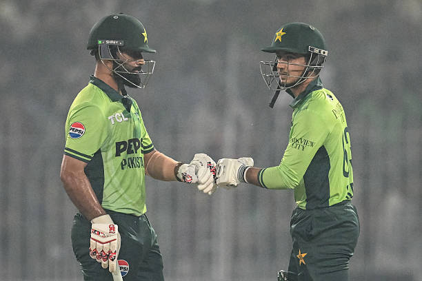 Pakistan's Fakhar Zaman and Saim Ayub bump their fists during the first one-day international cricket match between Pakistan and South Africa at the...