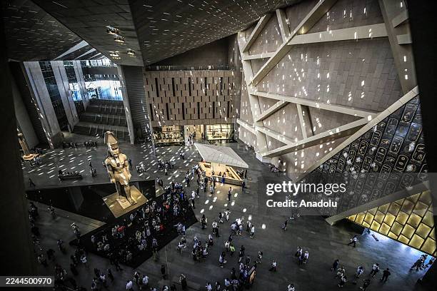 View shows the colossal statue of Ramses II at the entrance hall of the Grand Egyptian Museum, located just two kilometers from the Giza Pyramids in...