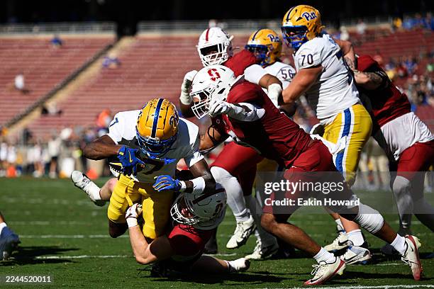 Deuce Spann of the Pittsburgh Panthers jumps into the end zone for a touchdown against Matt Rose of the Stanford Cardinal in the second quarter at...