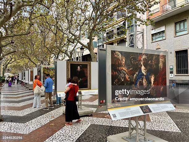 el prado museum street exhibition in gandia attracting visitors, valencia, spain - espetáculo de arte imagens e fotografias de stock