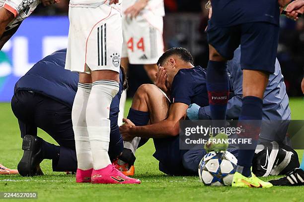 Paris Saint-Germain's Moroccan defender Achraf Hakimi reacts after picking up an injury during the UEFA Champions League, league phase day 4,...