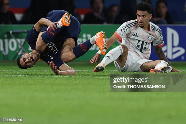 Bayern Munich's Colombian forward Luis Diaz tackles Paris Saint-Germain's Moroccan defender Achraf Hakimi during the UEFA Champions League, league...