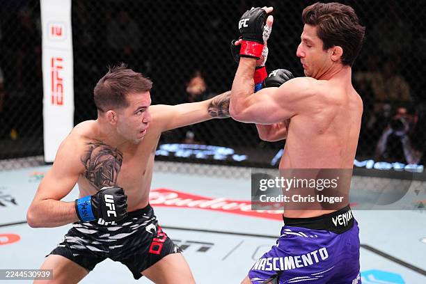 Cody Durden punches Allan Nascimento of Brazil in a 130-pound catchweight fight during the UFC Fight Night event at UFC APEX on November 01, 2025 in...