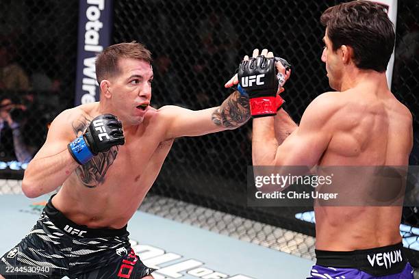 Cody Durden punches Allan Nascimento of Brazil in a 130-pound catchweight fight during the UFC Fight Night event at UFC APEX on November 01, 2025 in...