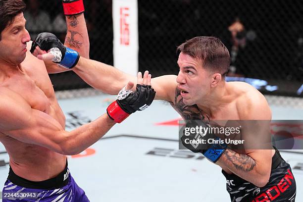 Cody Durden punches Allan Nascimento of Brazil in a 130-pound catchweight fight during the UFC Fight Night event at UFC APEX on November 01, 2025 in...