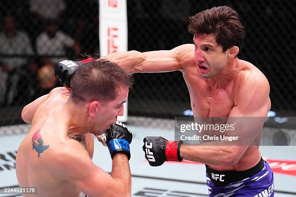 Allan Nascimento of Brazil punches Cody Durden in a 130-pound catchweight fight during the UFC Fight Night event at UFC APEX on November 01, 2025 in...