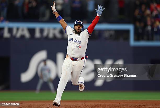 Vladimir Guerrero Jr. #27 of the Toronto Blue Jays celebrates after Bo Bichette hits a three-run home run against Shohei Ohtani of the Los Angeles...