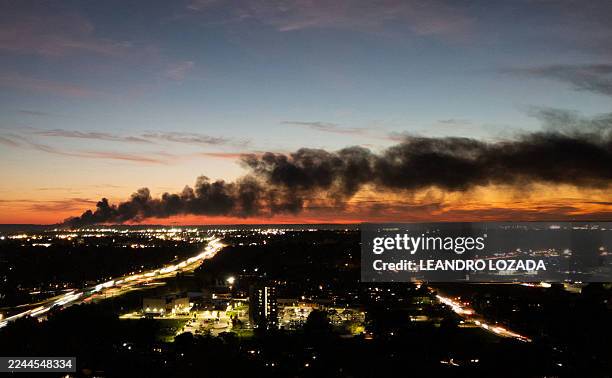 Smoke rises from the site of a UPS cargo plane crash near the UPS Worldport at Louisville Muhammad Ali International Airport in Louisville, Kentucky,...